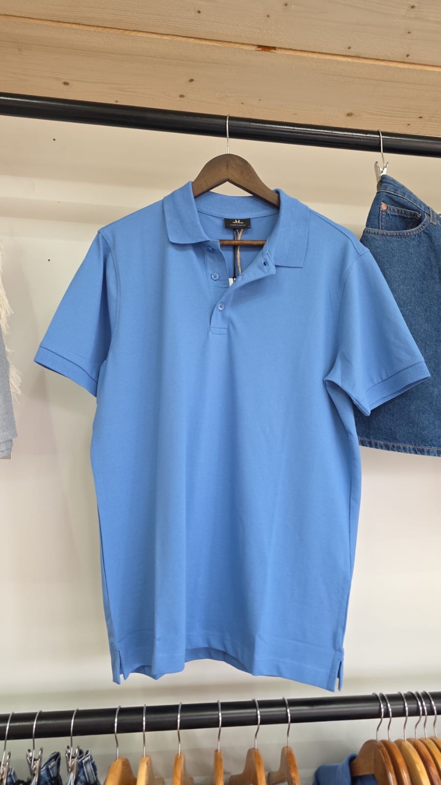 Tee Jays sky blue polo shirt — light and professional, front view