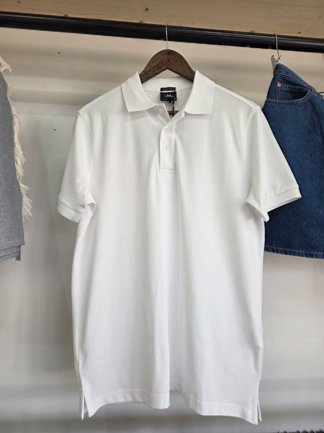 Tee Jays white polo shirt — clean and professional, front view