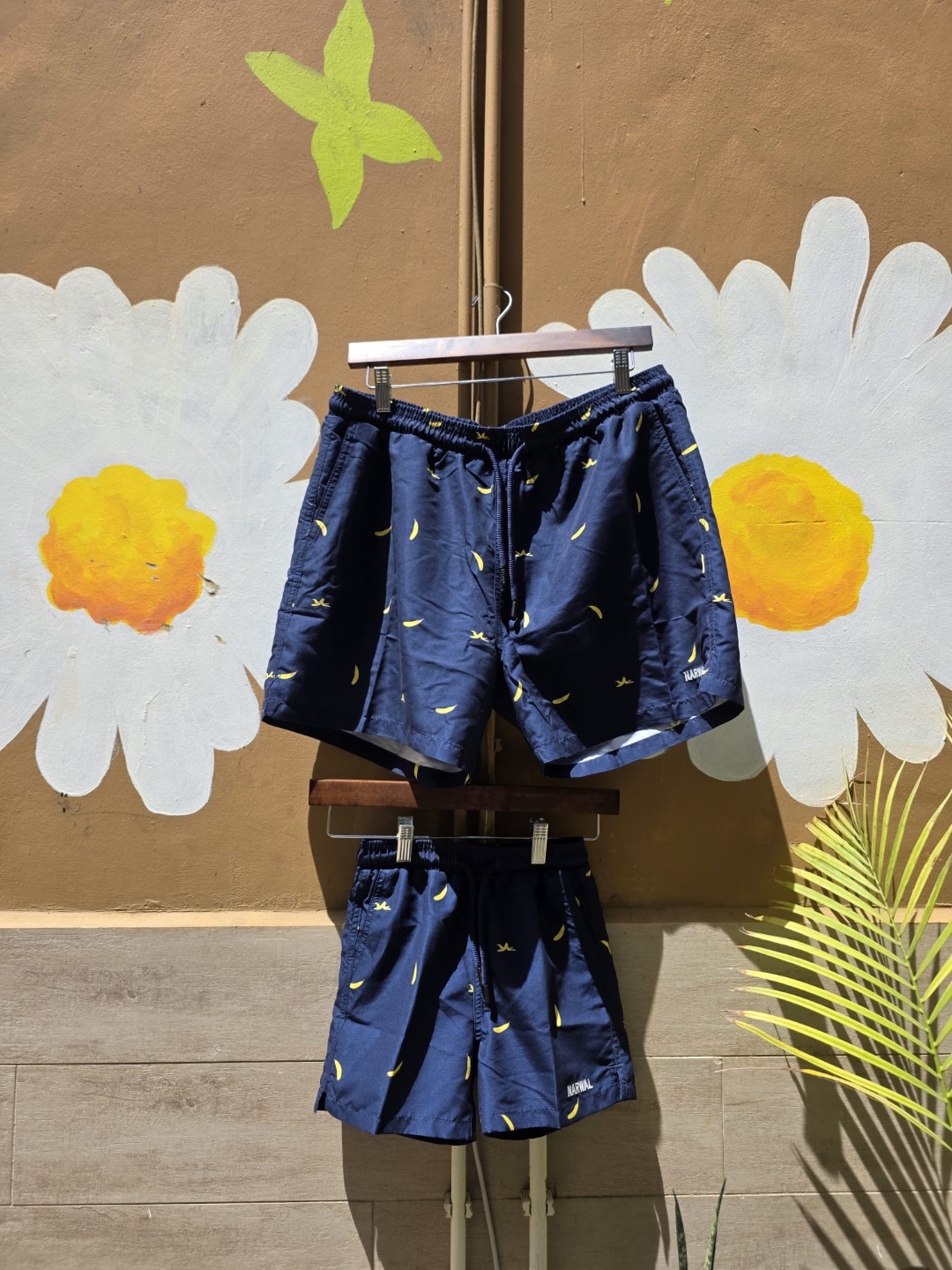 Narwal banana print swim shorts daddy and me set — daisy wall backdrop