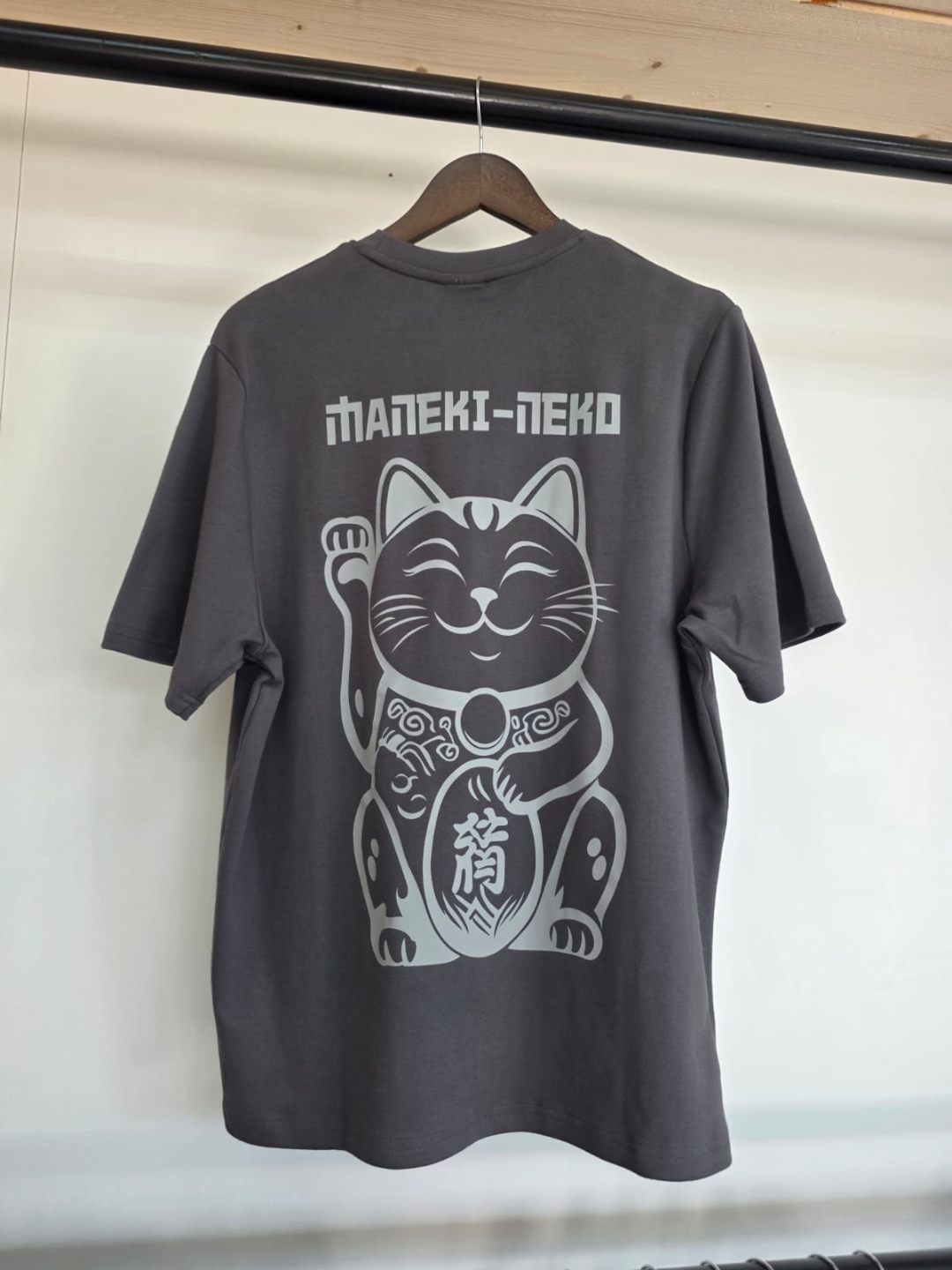 Dark grey t-shirt with large Maneki-Neko lucky cat graphic on back