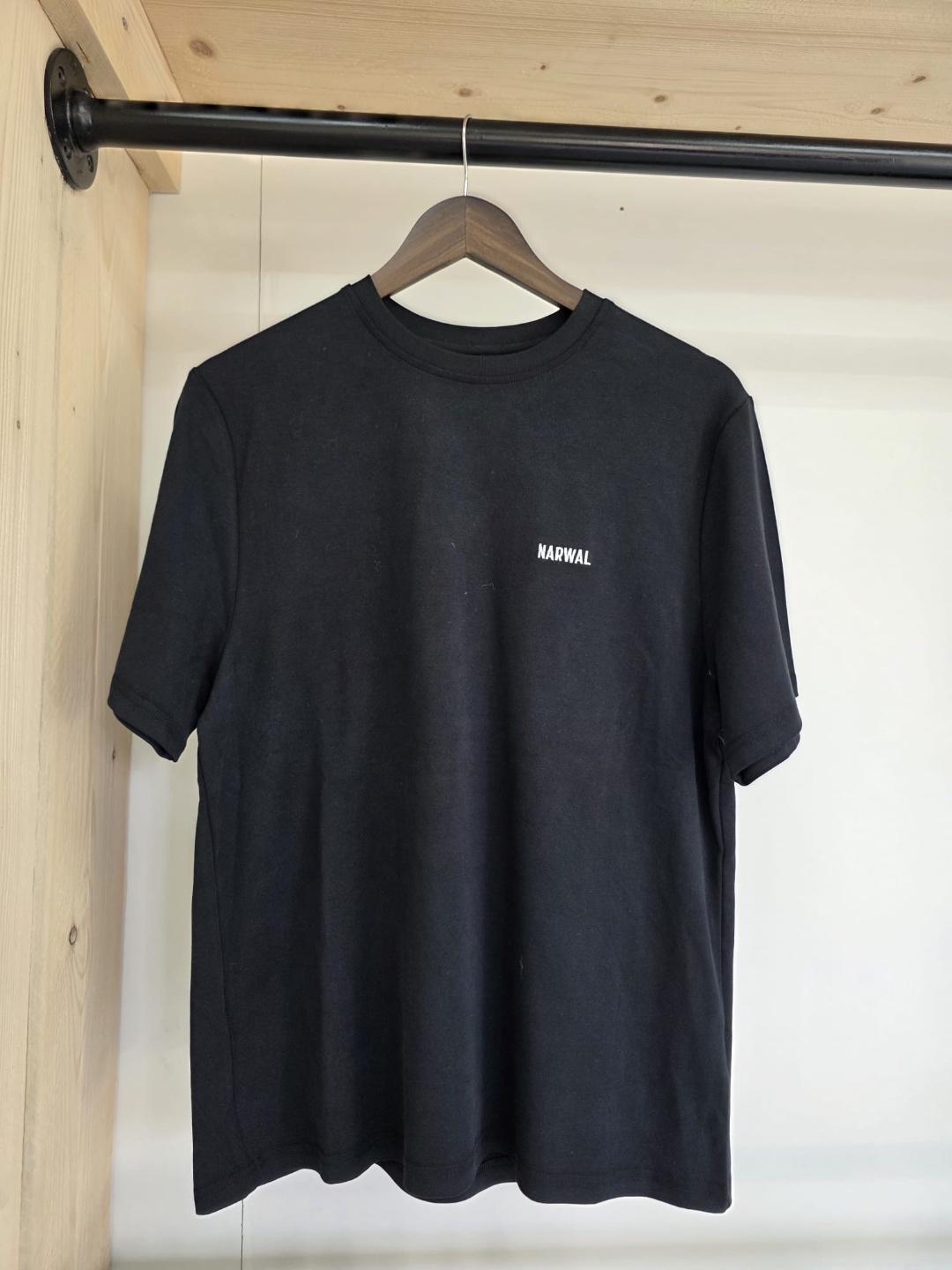 Narwal black t-shirt with minimalist white Narwal logo on chest