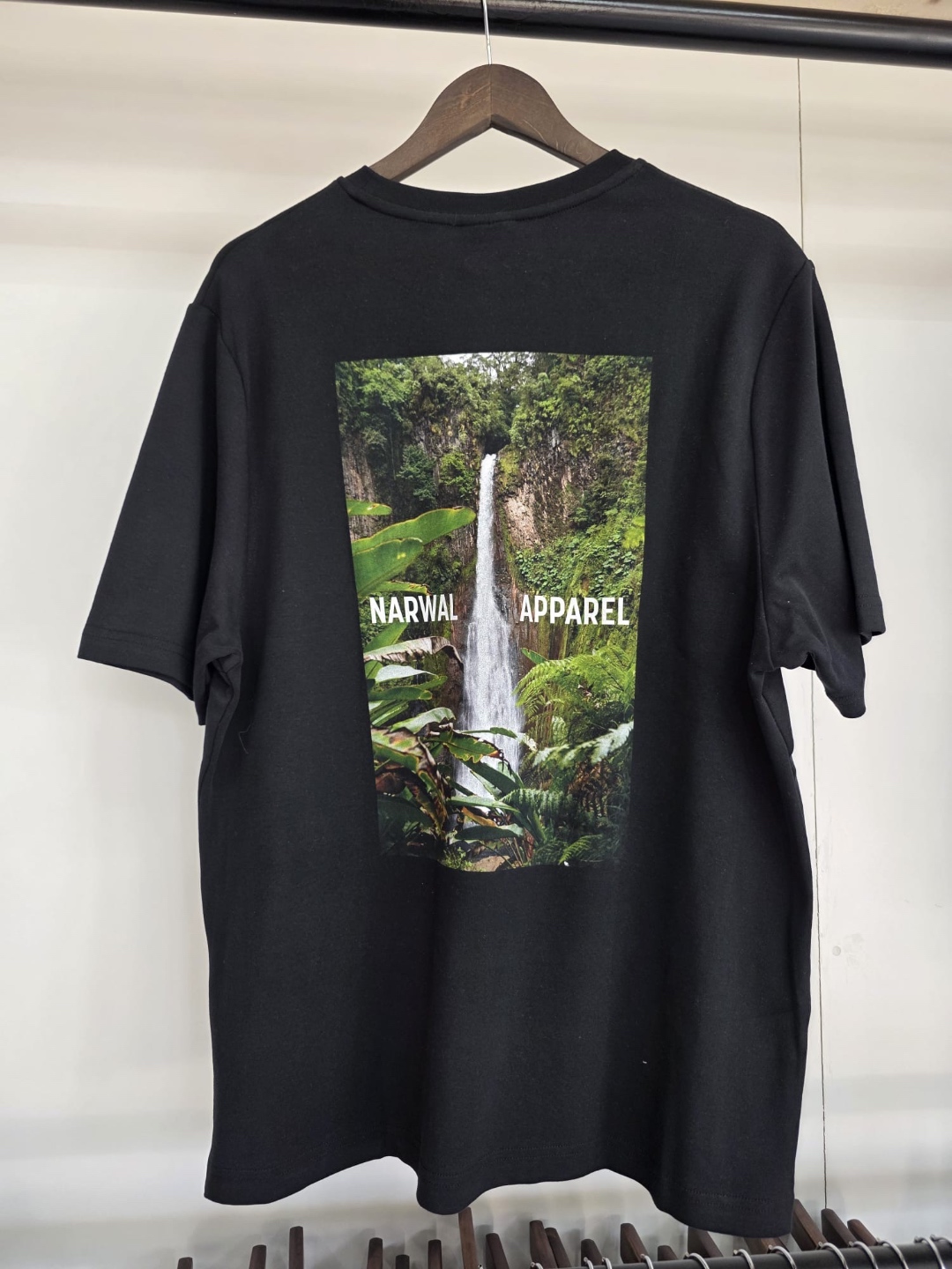 Narwal Apparel black tee — waterfall jungle graphic print on back