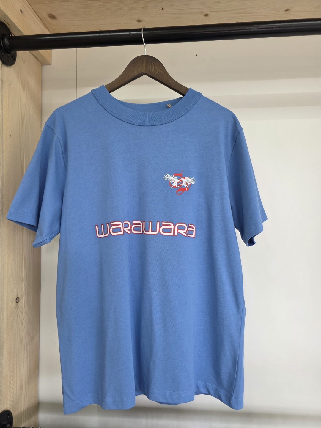 Tuushirt Warawara blue tee — Warawara logo on chest with flying bird emblem