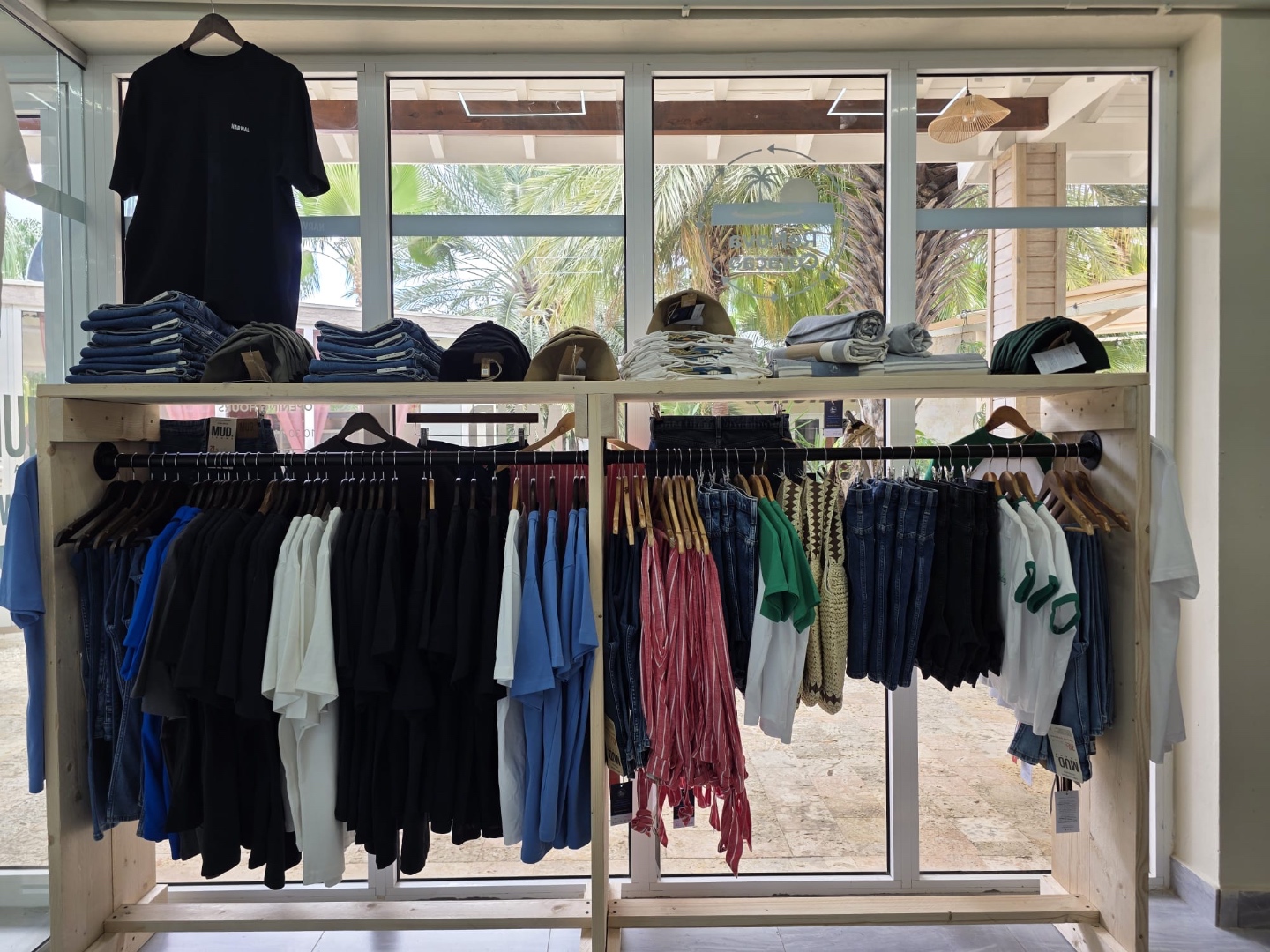 ReNova Curaçao store interior with professional clothing racks